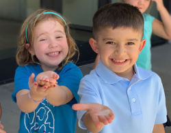 Students holding ice cubes