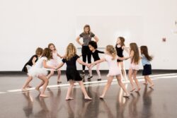Dance club ballerinas dancing in a circle